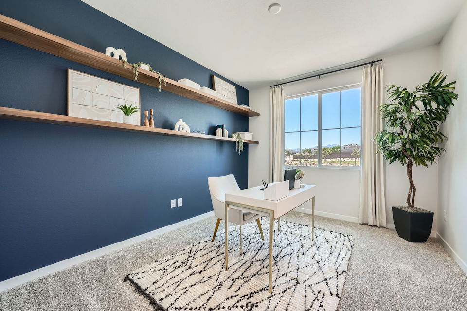 A room with a table and chairs.