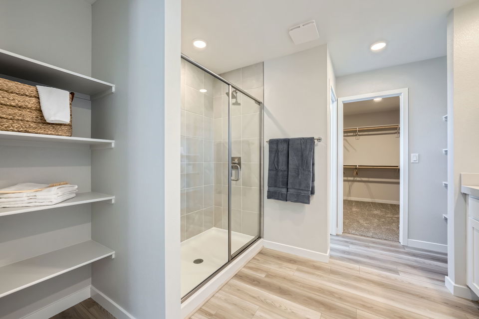 A bathroom with a glass shower.
