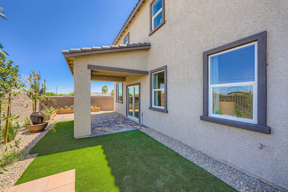 A house with a grass yard.