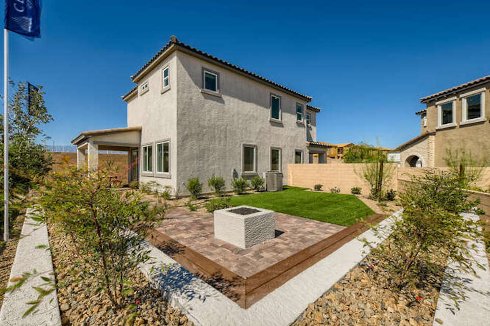 A house with a pool in the front yard.