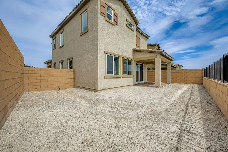 A building with a large front yard.
