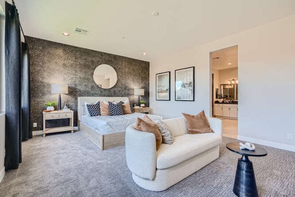 A living room with a couch and a table.