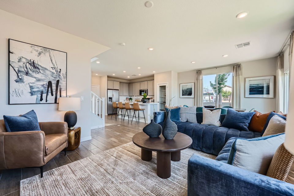 A living room with blue couches.