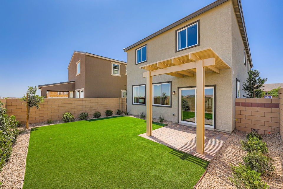 A house with a green lawn.