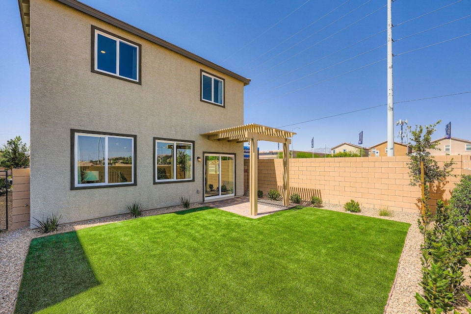 A house with a grass yard.