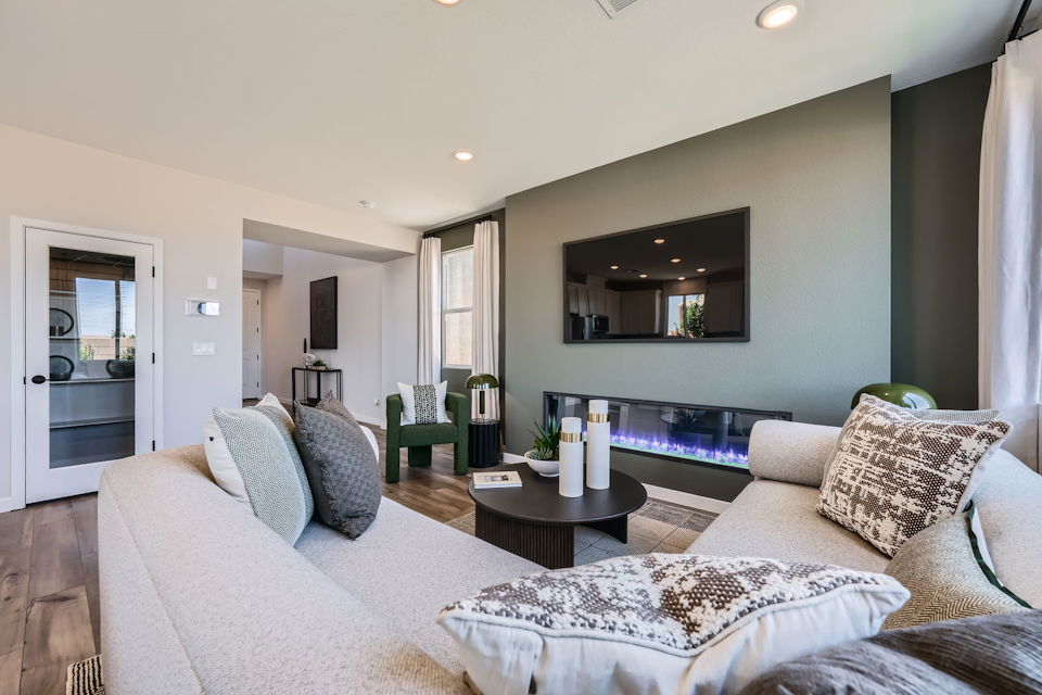 A living room with a large mirror.