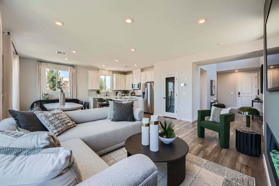 A living room with a couch and a table.
