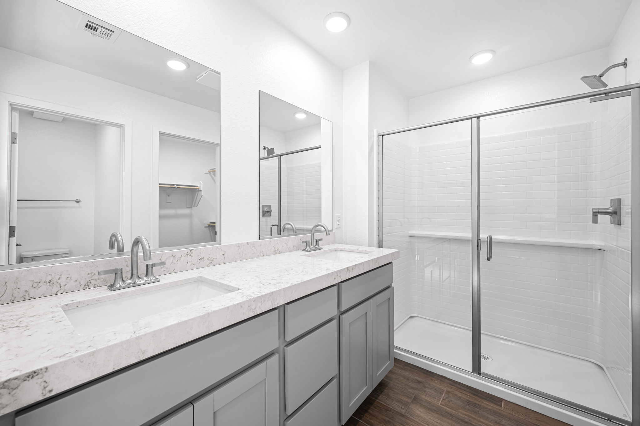 A bathroom with a glass shower.