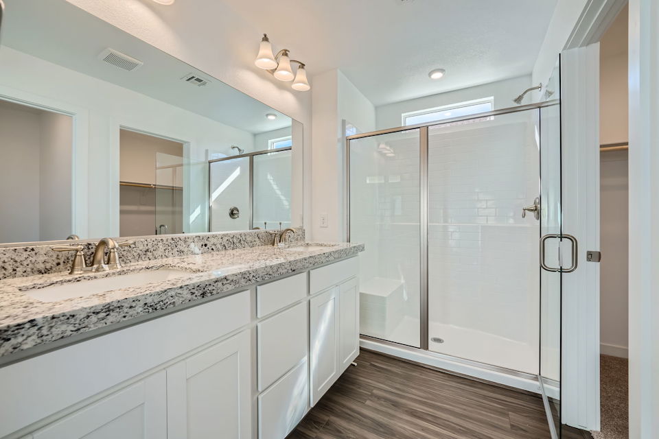 A bathroom with a marble countertop.