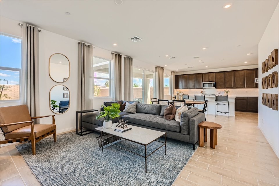 A living room with a couch and a table.