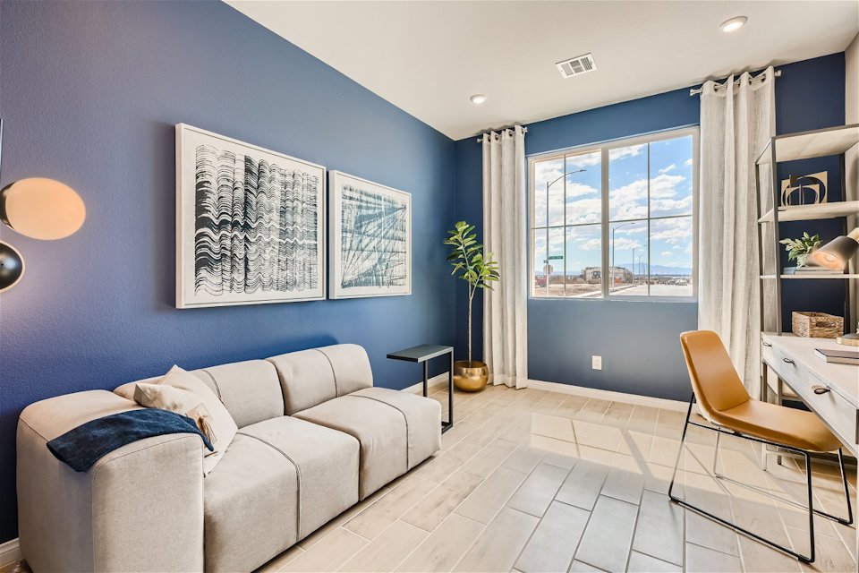 A room with a couch and a table.