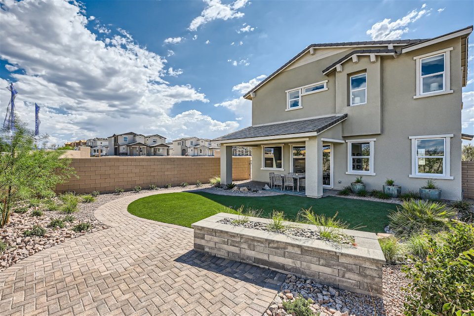 A house with a brick driveway.