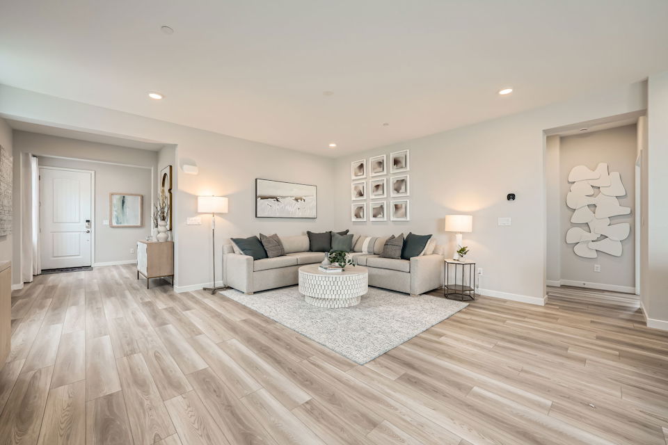 A living room with a wood floor.