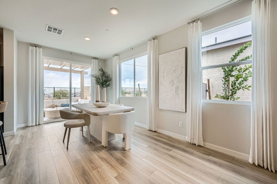 A room with a table and chairs.