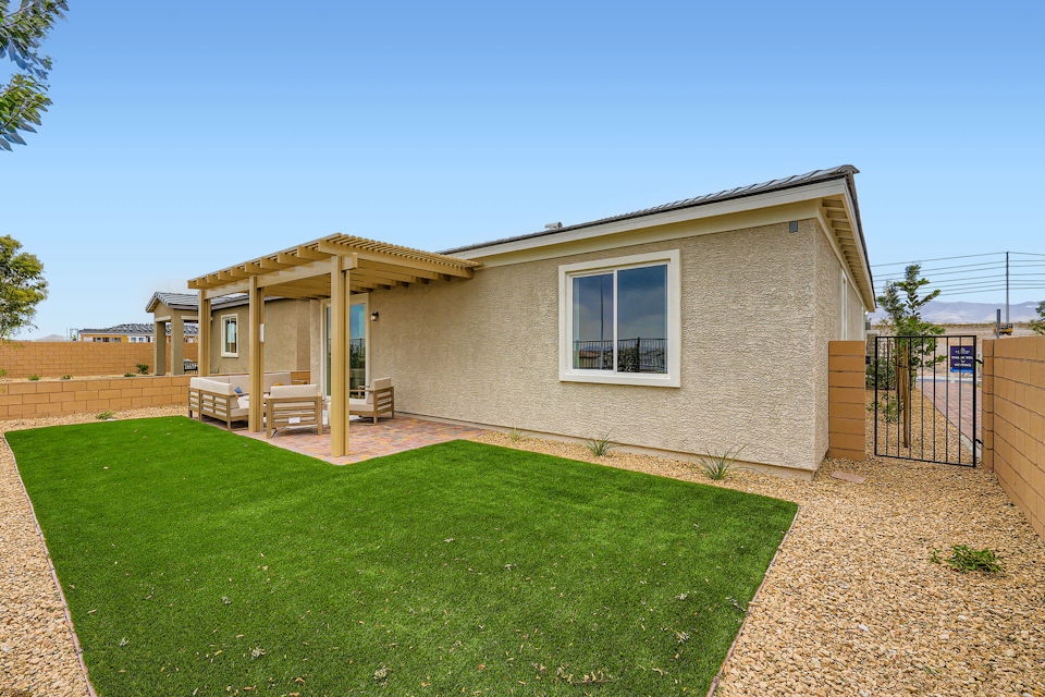 A house with a green lawn.