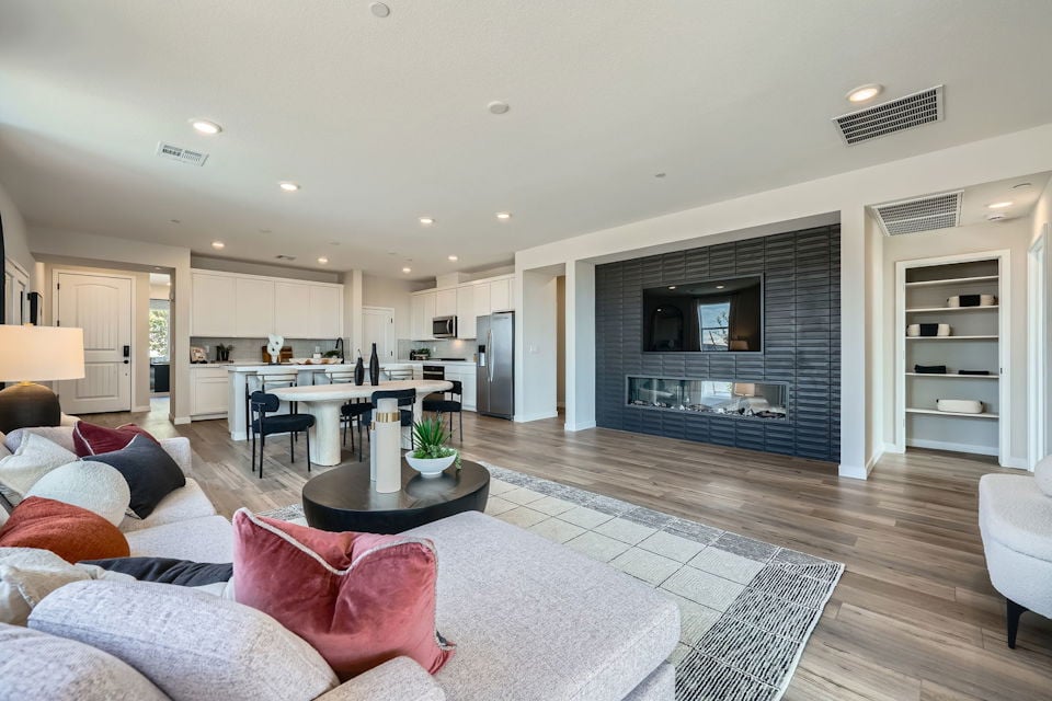 A living room with a fireplace.