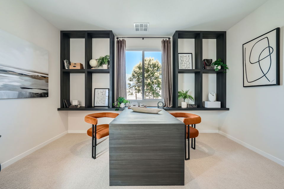 A room with a table and chairs.