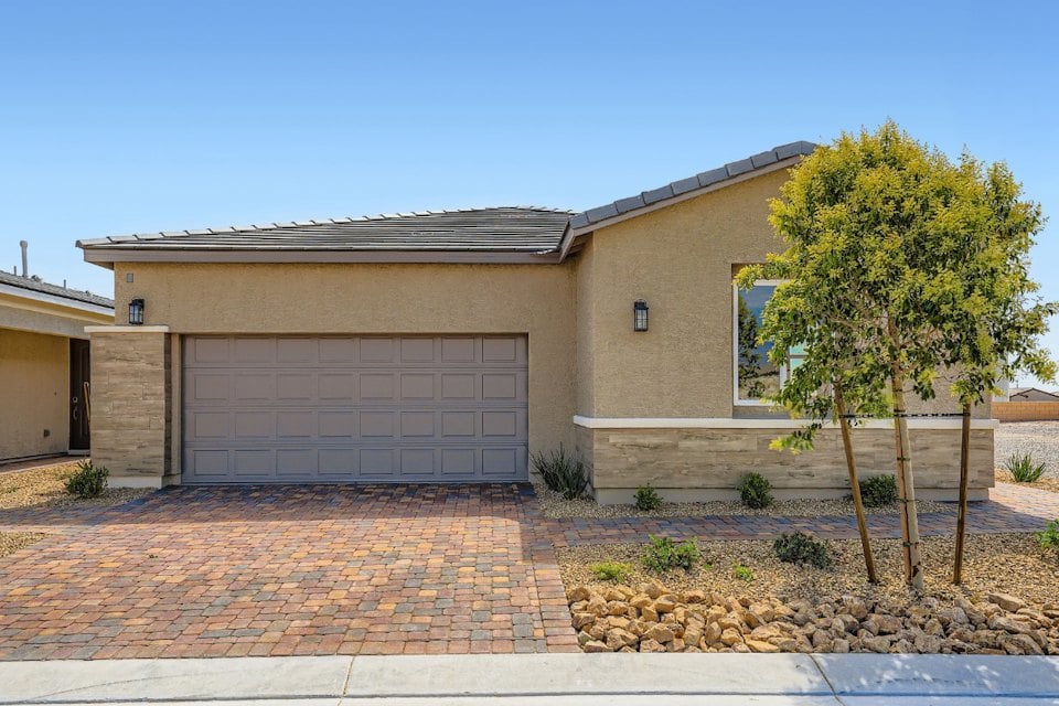 A building with a brick driveway.