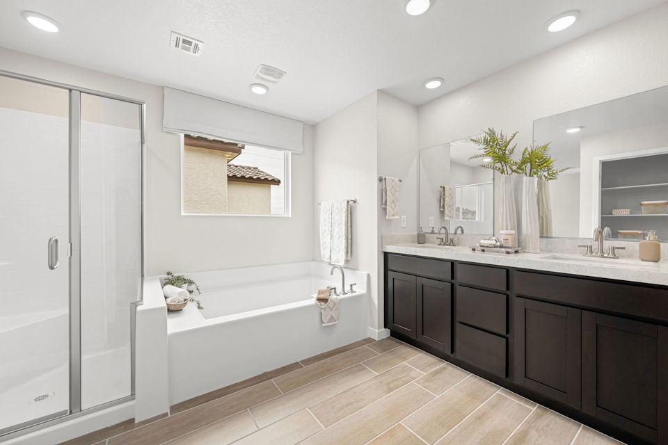 A bathroom with a tub and sink.