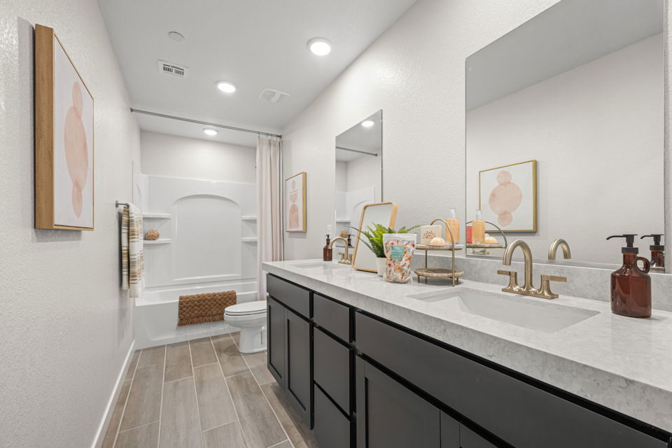 A bathroom with a marble countertop.