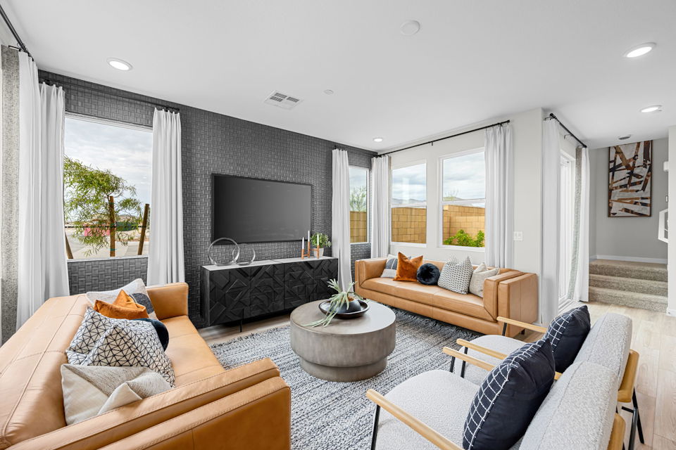 A living room with a tv and couches.