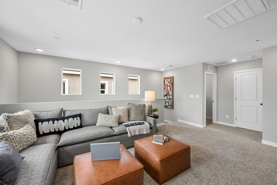 A living room with a couch and a coffee table.