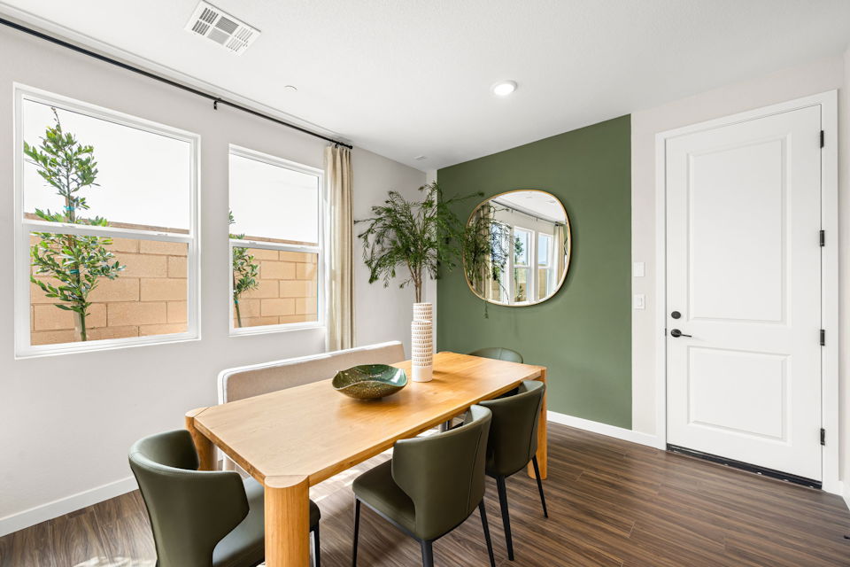 A room with a table and chairs.