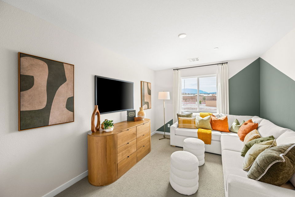 A living room with a tv and couches.