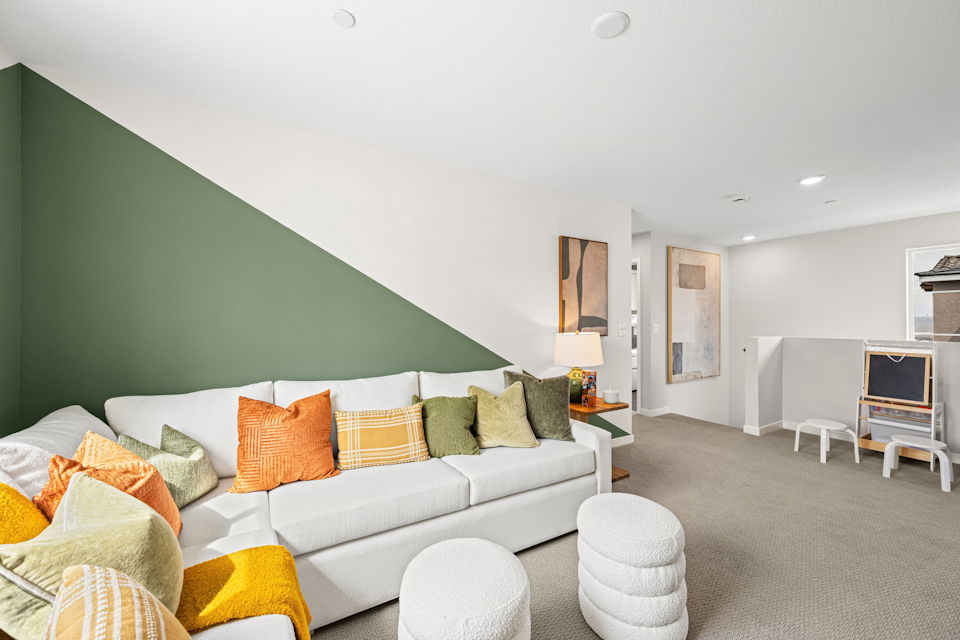 A living room with a couch and a tv.