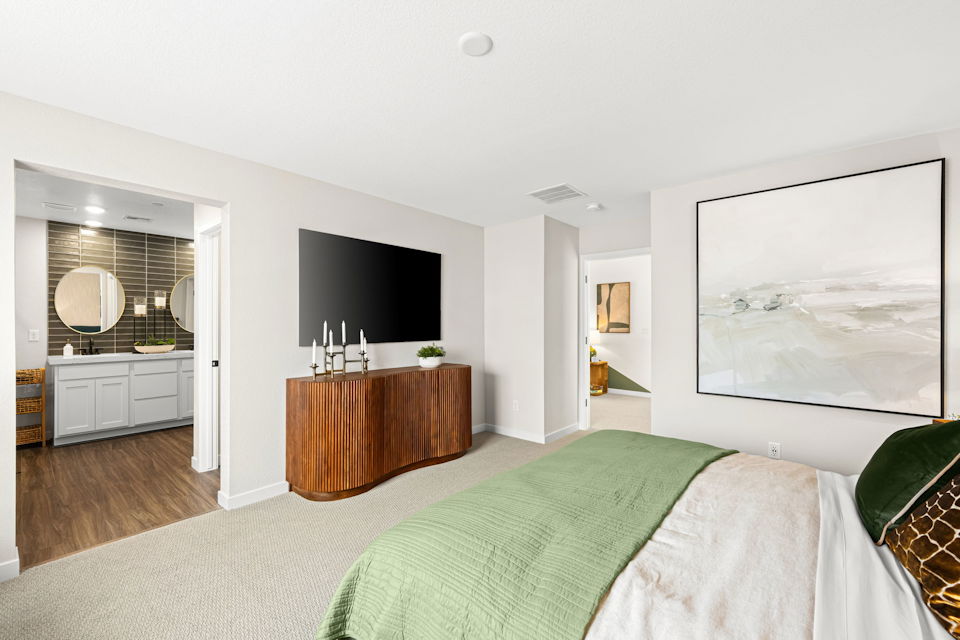 A bedroom with a tv and a bed.