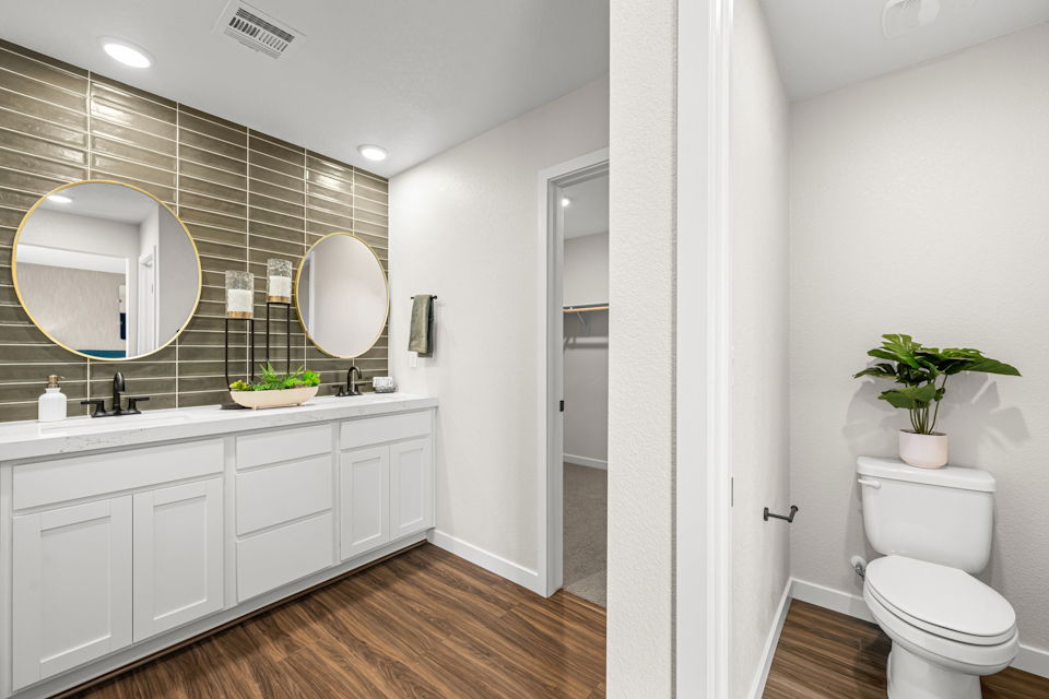 A bathroom with a toilet and sink.