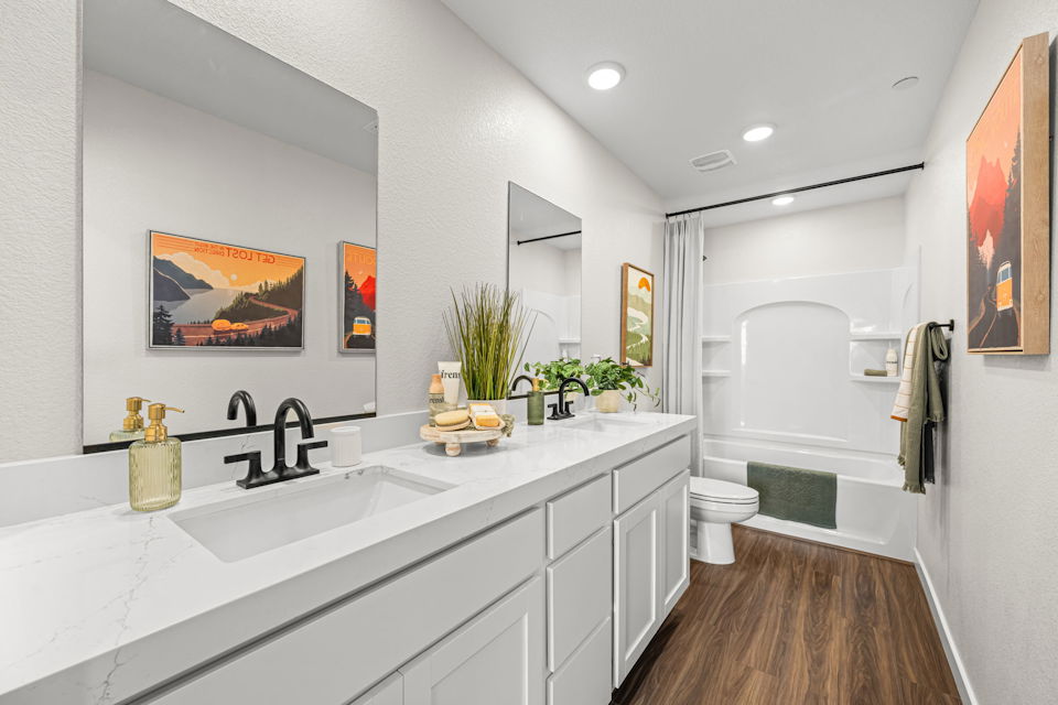 A bathroom with a sink and a toilet.