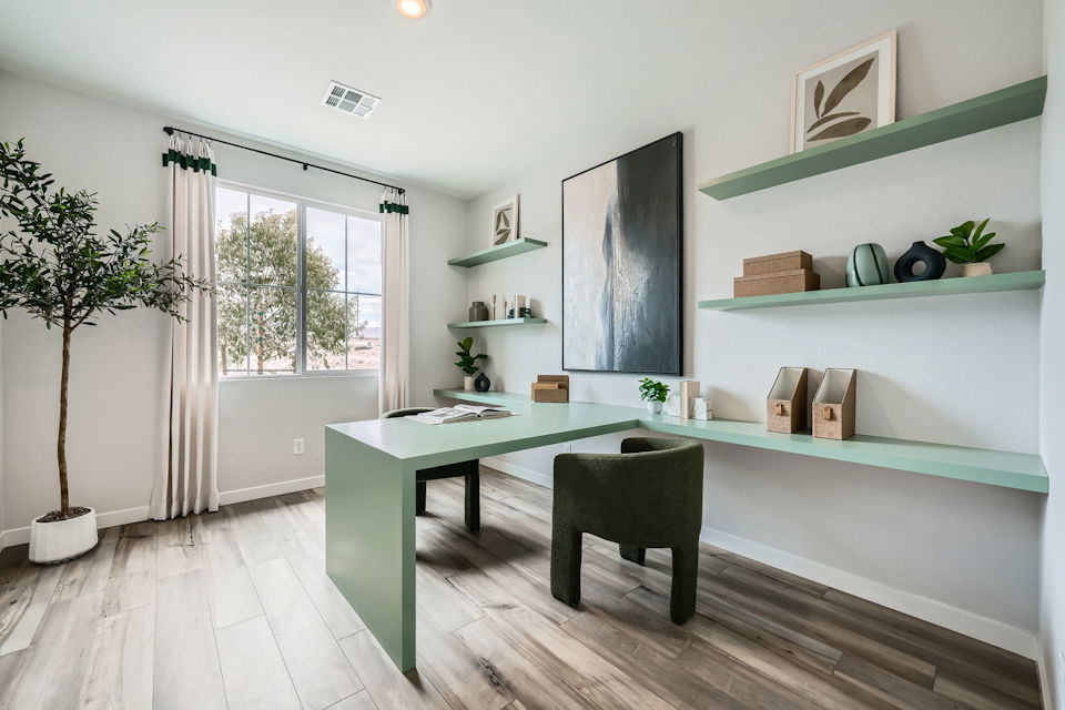 A room with a table and chairs.