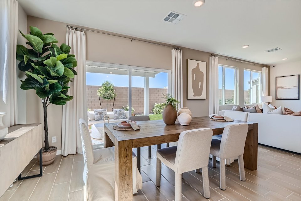 A dining room with a large window.