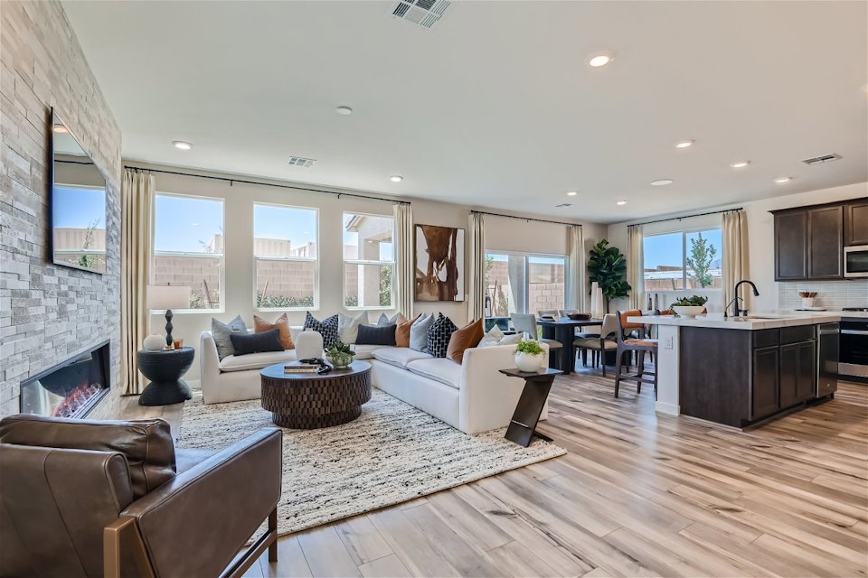 A large living room with a fireplace.