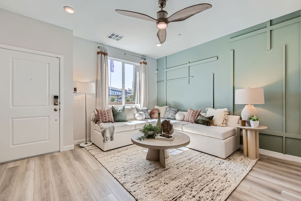 A living room with a couch and a table.
