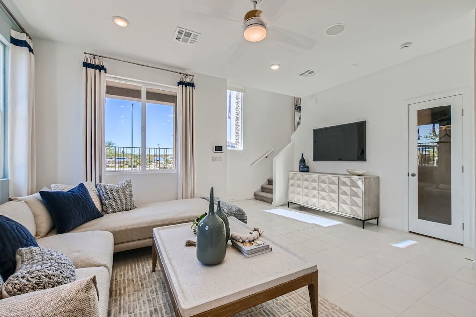 A living room with a tv and couches.