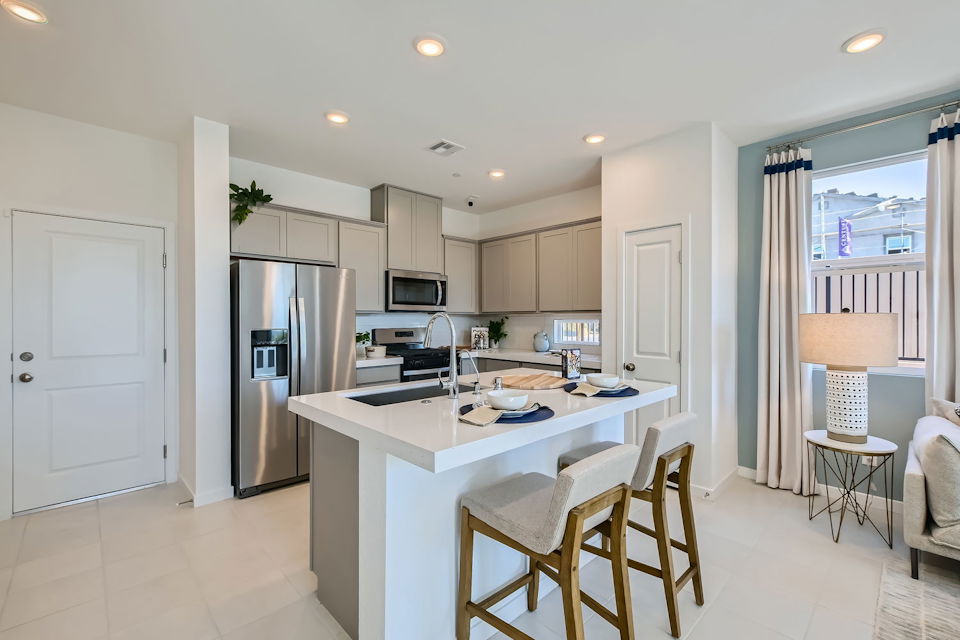 A kitchen with a dining table.