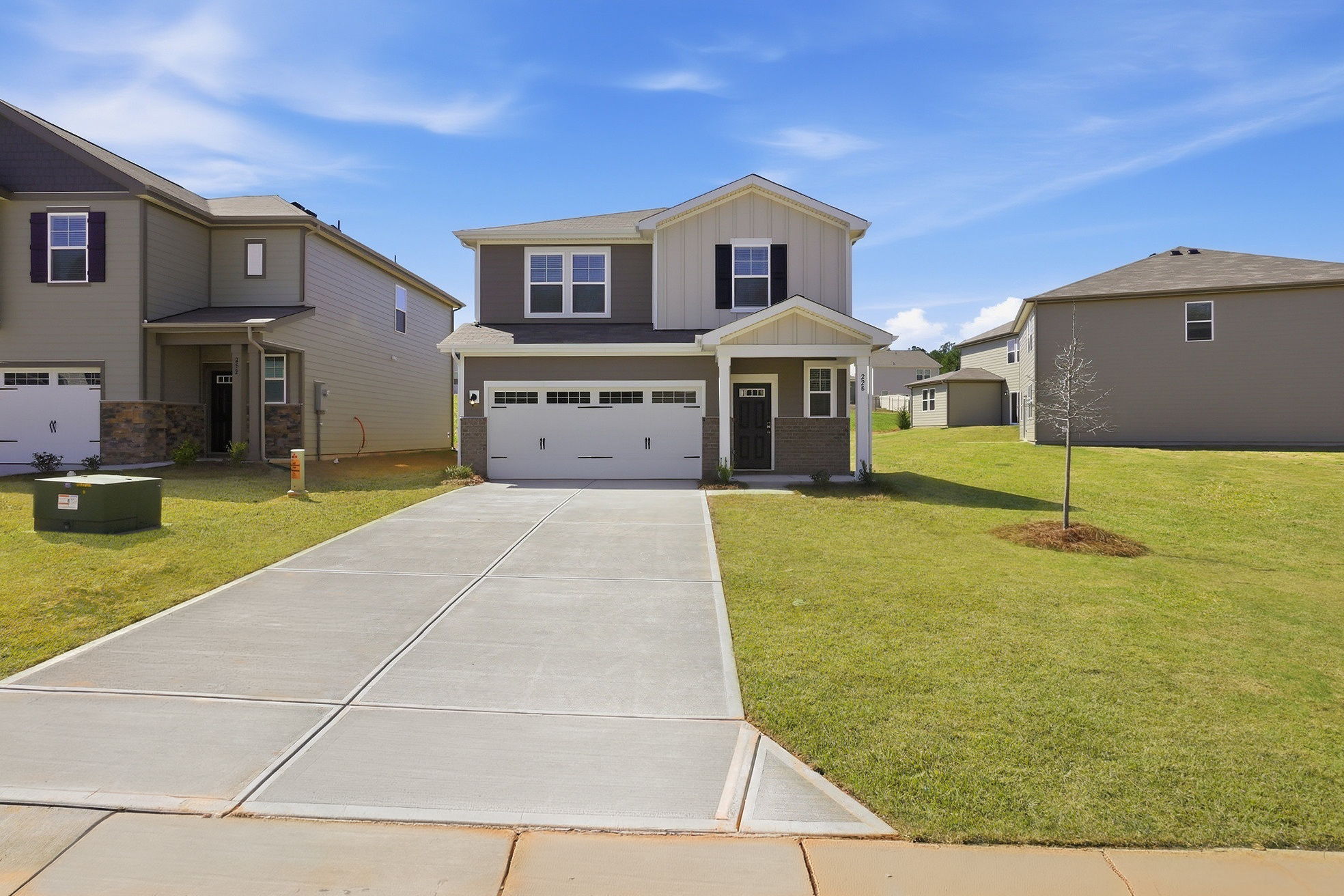 A driveway leading to a house.