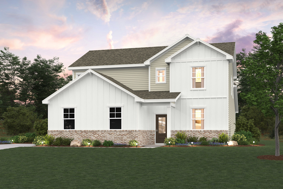 A white house with a lawn.