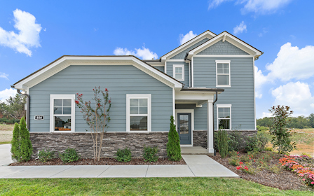 A house with a large front yard.