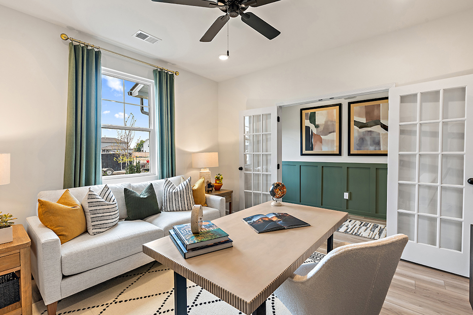 A living room with a couch and a table.