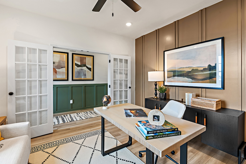 A living room with a large television.