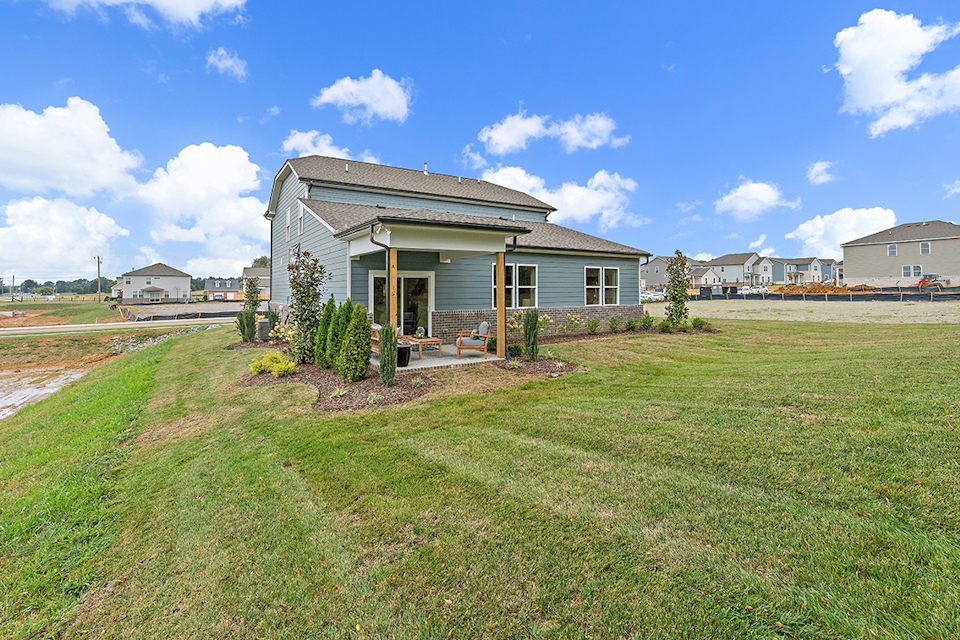 A house with a grass yard.