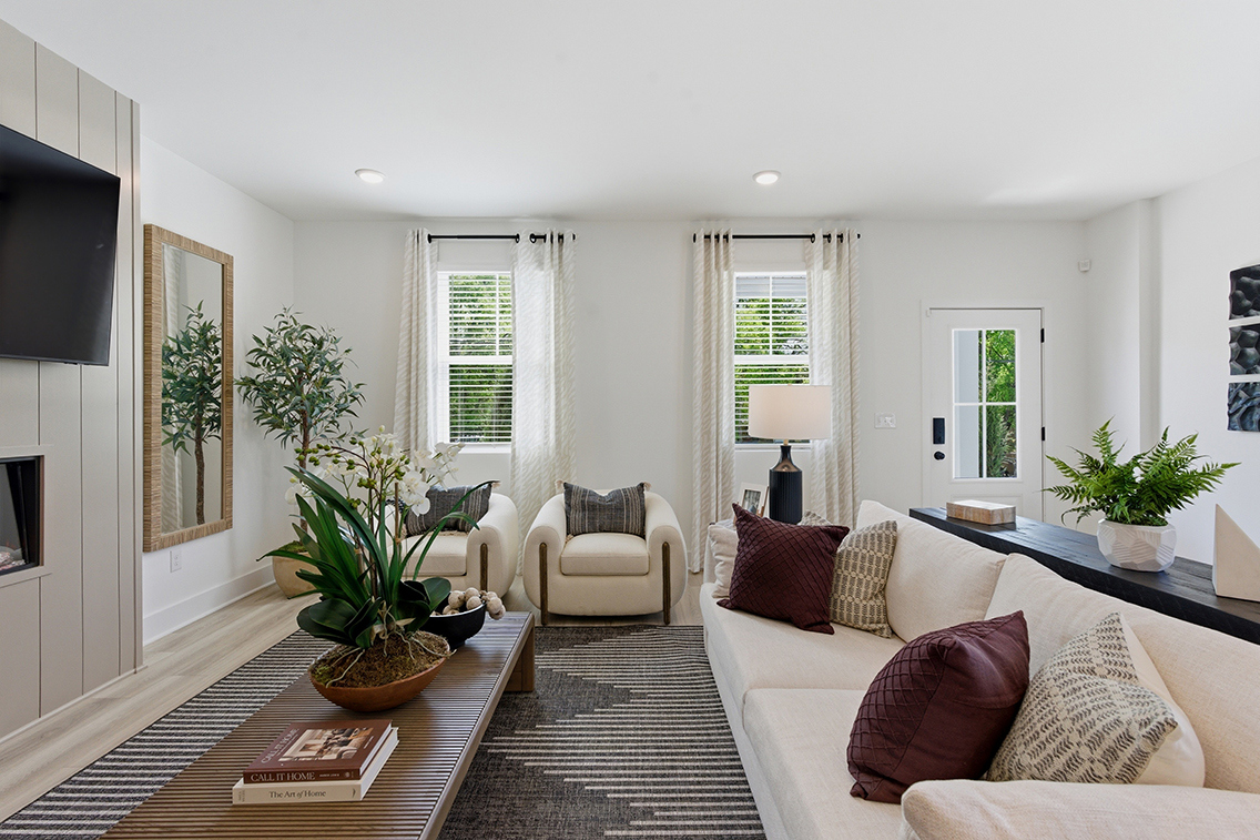 A living room with a couch and a table.