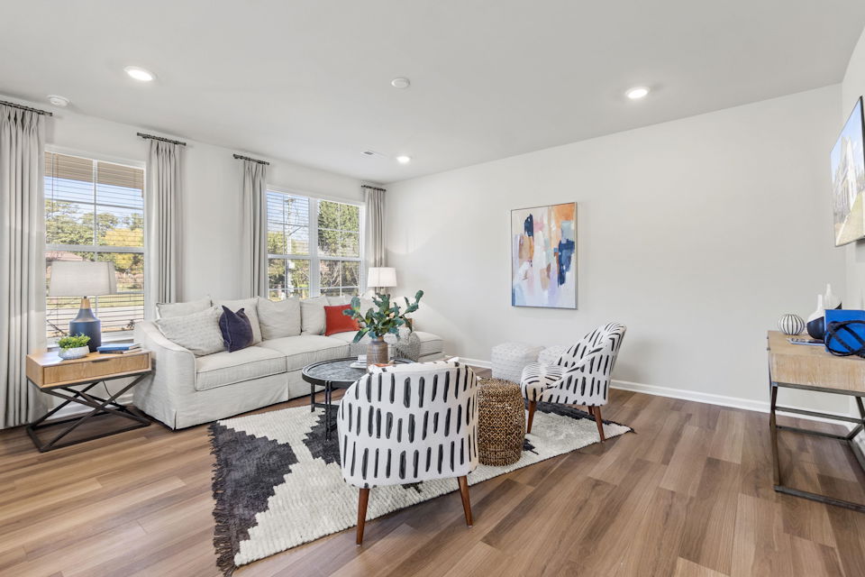 A living room with a wood floor.