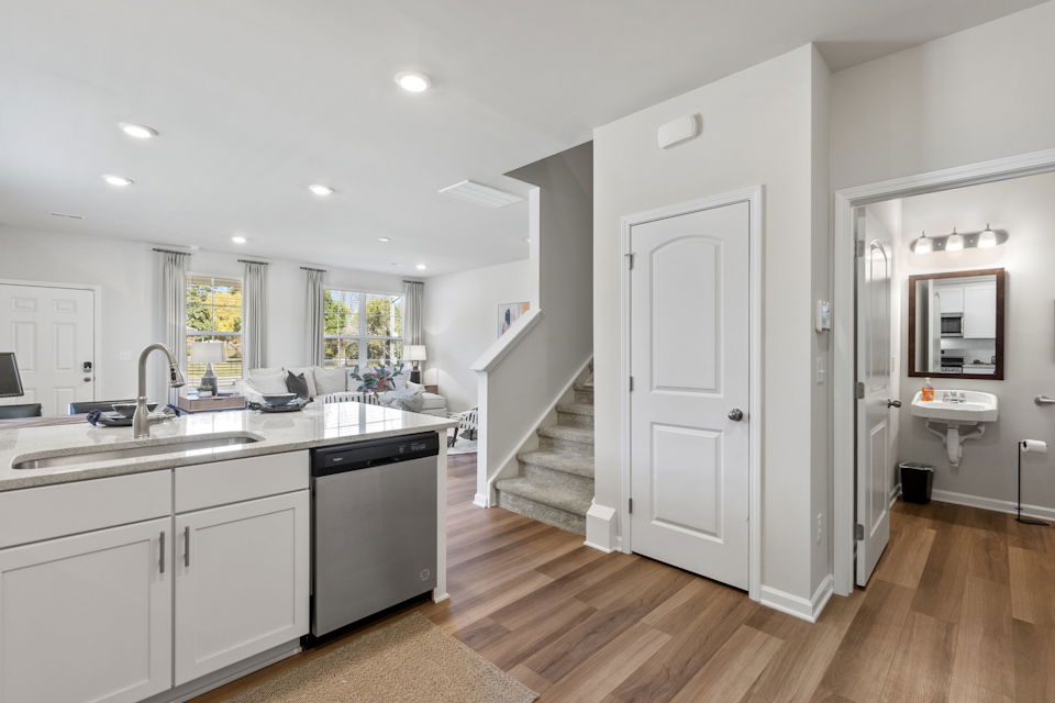 A large kitchen with white cabinets.