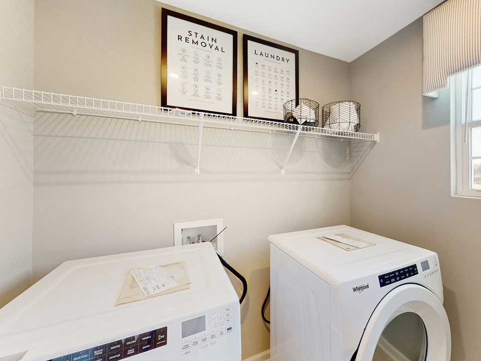 A laundry room with a washer and dryer.