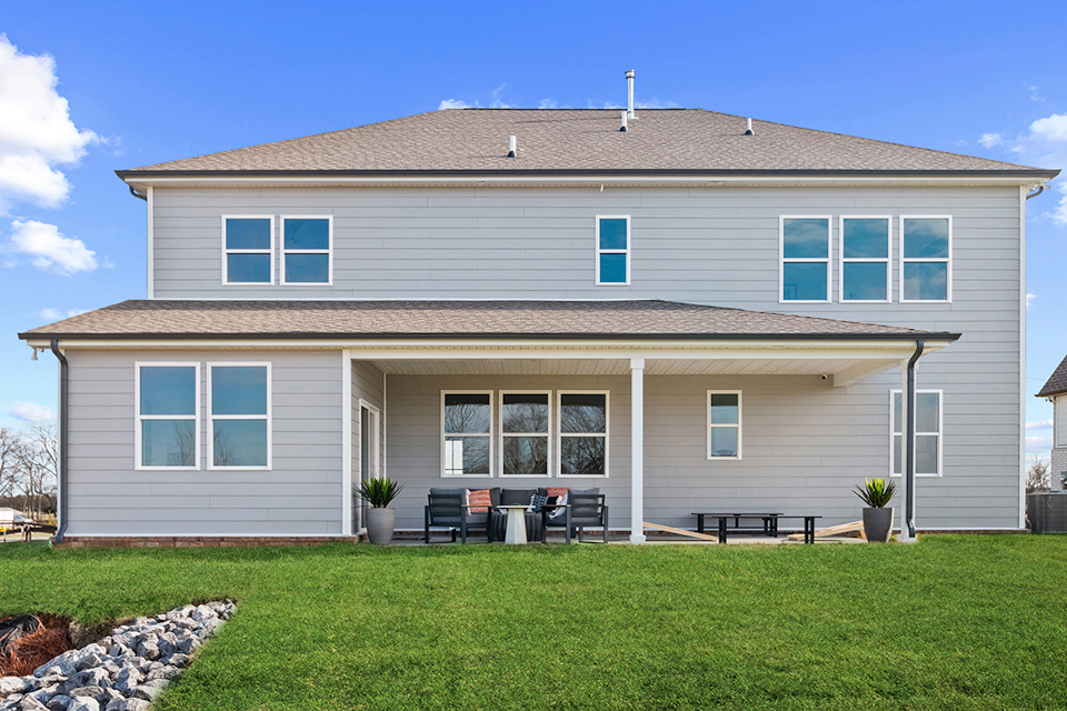 A house with a lawn in front.