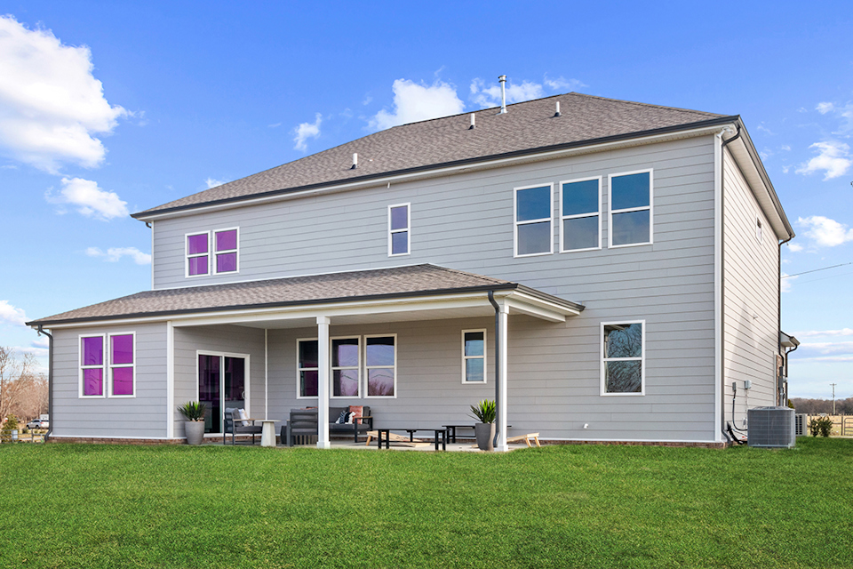A house with a lawn in front.